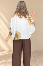 Blusa amarra flor verde